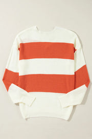 Orange and white striped V-neck knit sweater with a slouchy fit