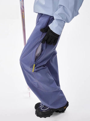 Men's blue loose fit cargo sweatpants with zippered side vent detail.