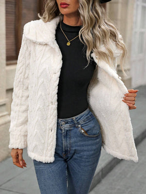 Cream cable knit collar jacket with button closure and textured detail.