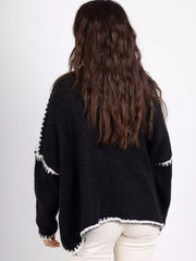 Black oversized cardigan with contrast white trim detail on sleeves and hem