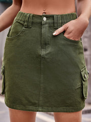 Army green denim mini skirt with cargo pockets and a button closure.
