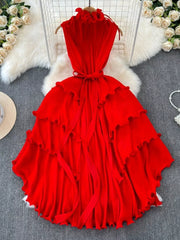 Ruffled tiered midi dress in rose red with belted waist and frill details.