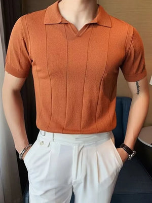 Orange textured knit polo shirt with vertical ribbing and short sleeves.