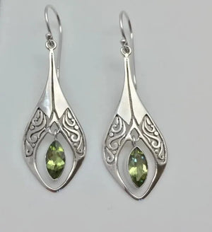 Silver filigree pear-drop earrings with marquise-cut peridot stones.