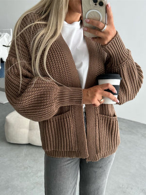 Textured puff sleeve cardigan in mocha with pockets and ribbed cuffs.