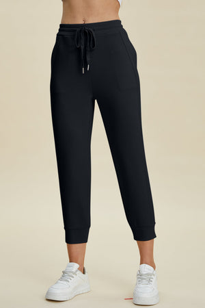 Black joggers with drawstring waist and cuffed ankles