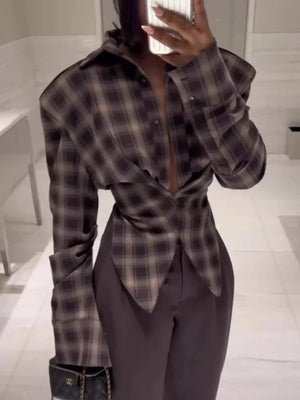 Chic ruched plaid button-down shirt with buttoned cuffs and a draped front.