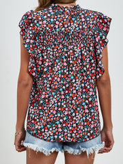 Black floral blouse with smocked yoke and ruffle sleeves