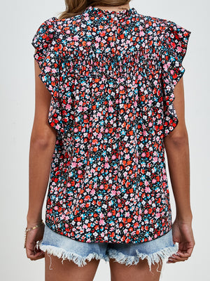 Black floral blouse with smocked yoke and ruffle sleeves