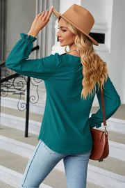 Deep Teal textured puff sleeve blouse with ruffle cuffs and a square neckline.