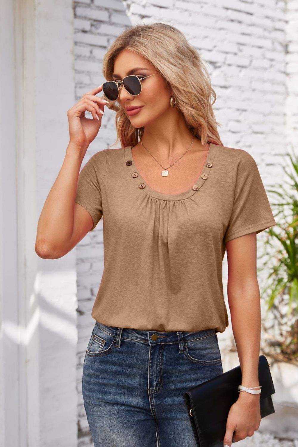 Mocha gathered yoke top with button trim and short sleeves.