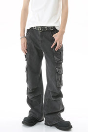 Baggy dark wash denim cargo pants with multiple pleated pockets and a relaxed fit.