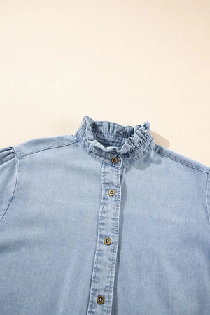 Light blue denim blouse with ruffled collar and puff sleeves, button front.