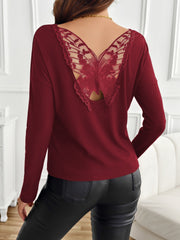 Burgundy ribbed knit top with a sheer lace butterfly back detail.