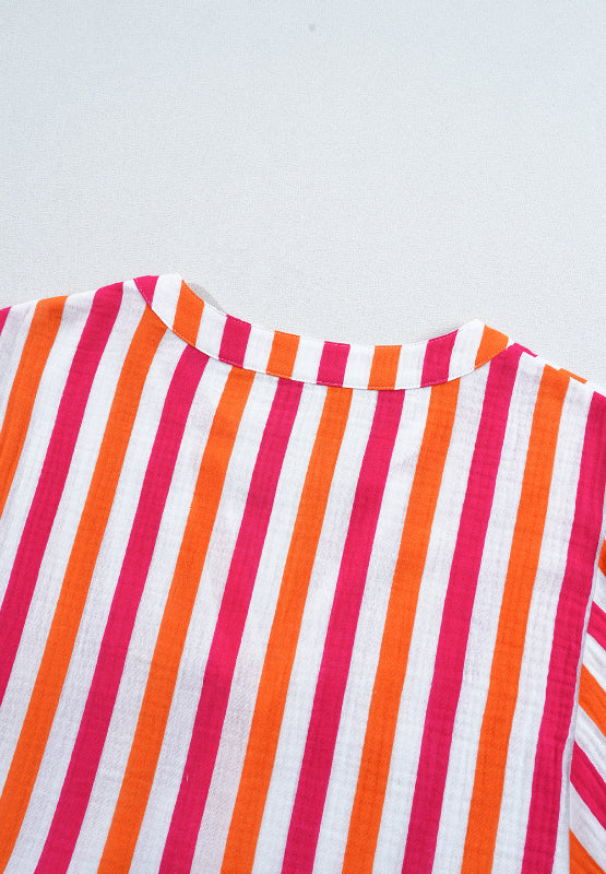 Textured stripe blouse in red, orange, and white with a gathered neckline detail.