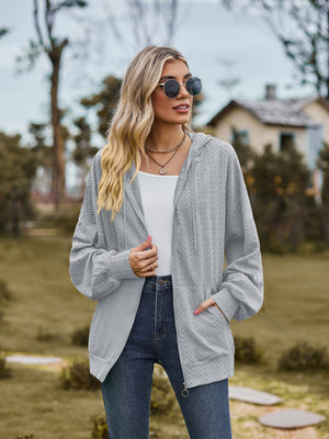 Textured knit dolman sleeve hoodie in Cloudy Blue with zip front and pockets.