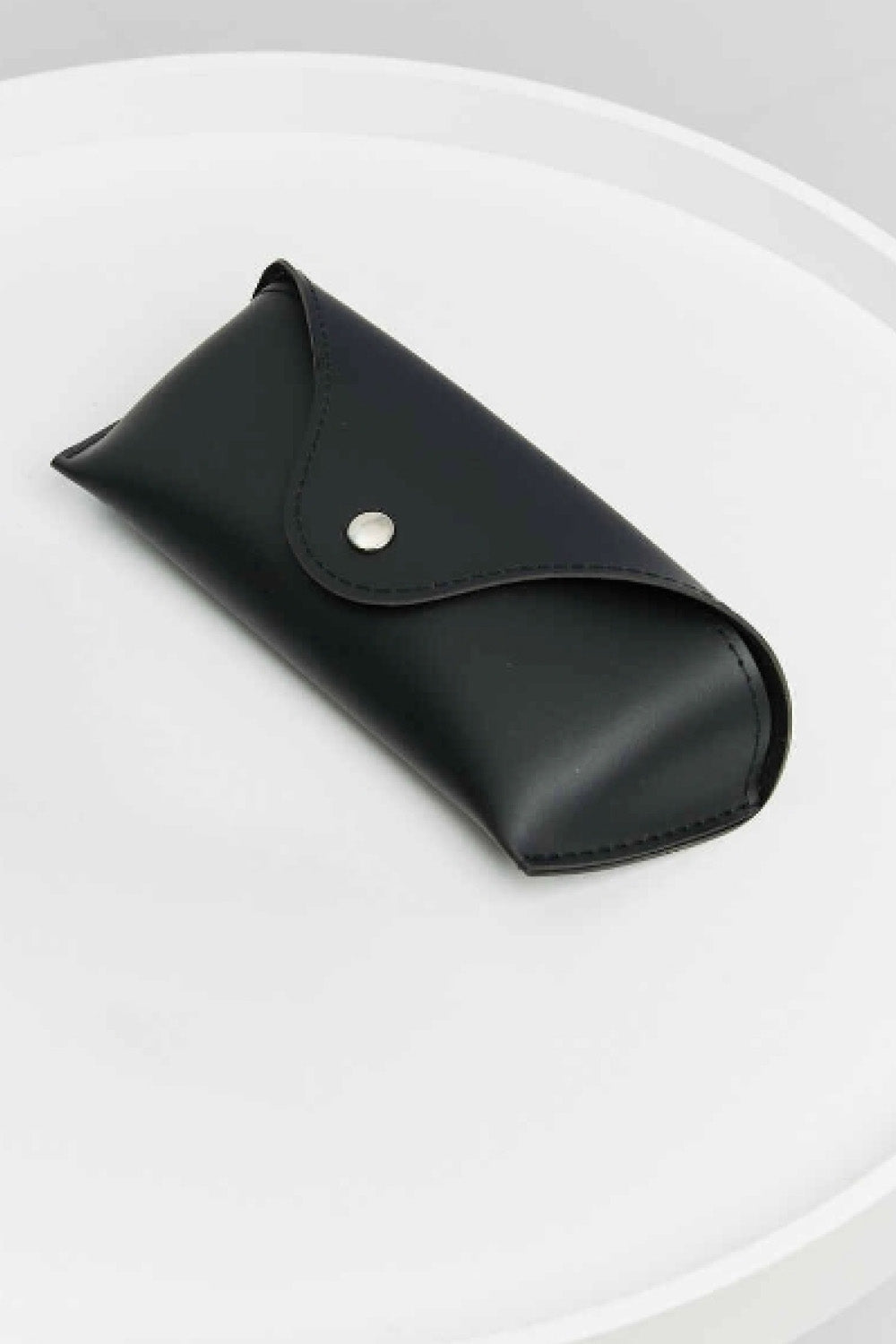 Black leather sunglasses case with snap closure