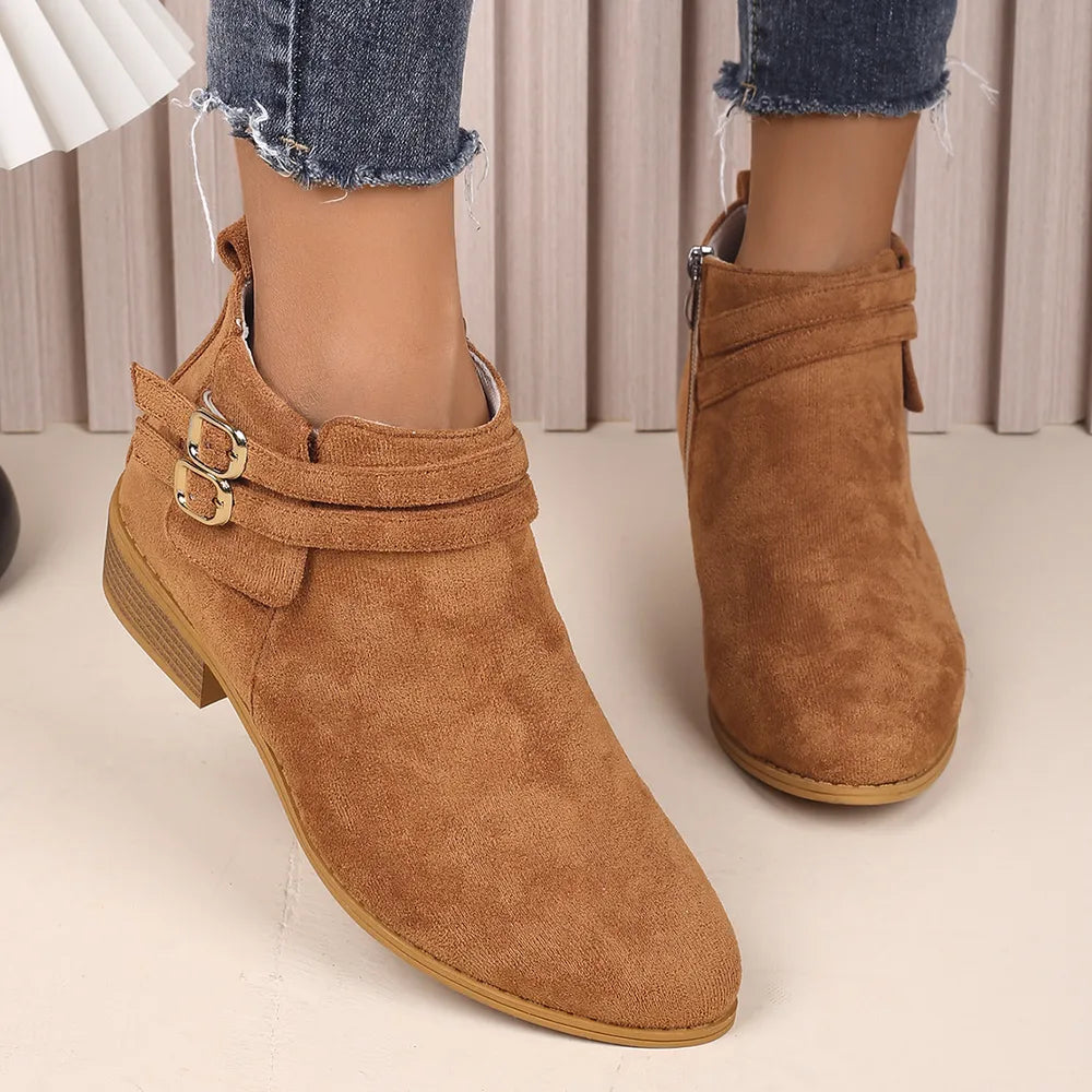 Ochre suede ankle booties with double buckle detail and side zipper.