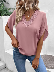 Dusty pink blouse with scalloped lace trim V-neck and flutter sleeves.