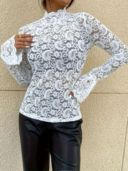 White lace bell sleeve blouse with mock neck and paisley pattern.