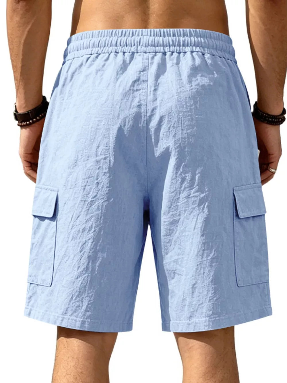 Light blue cargo shorts with drawstring waist and crinkled texture.