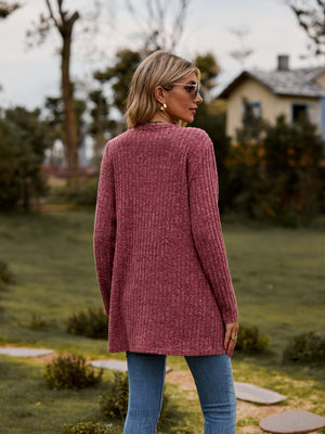 Longline ribbed knit button-down cardigan in rust, shown from the back.