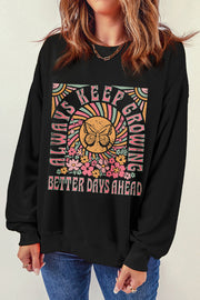 Black crewneck sweatshirt with butterfly and floral graphic and text.