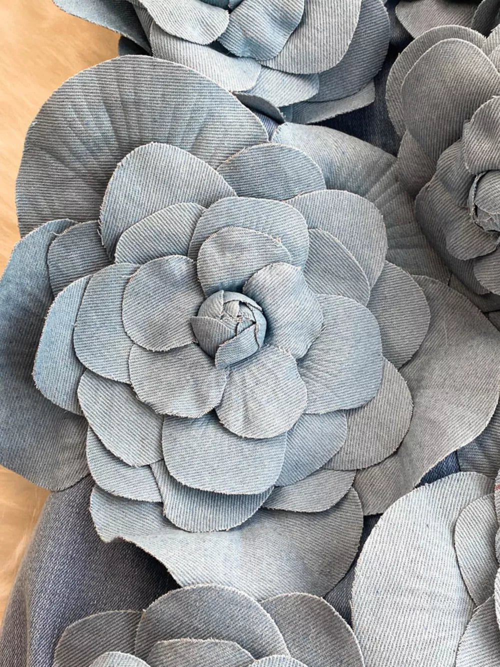 Denim dress with 3D floral appliques.