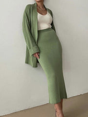 Ribbed knit co-ord set in Gum Leaf green, featuring a midi skirt and open cardigan.