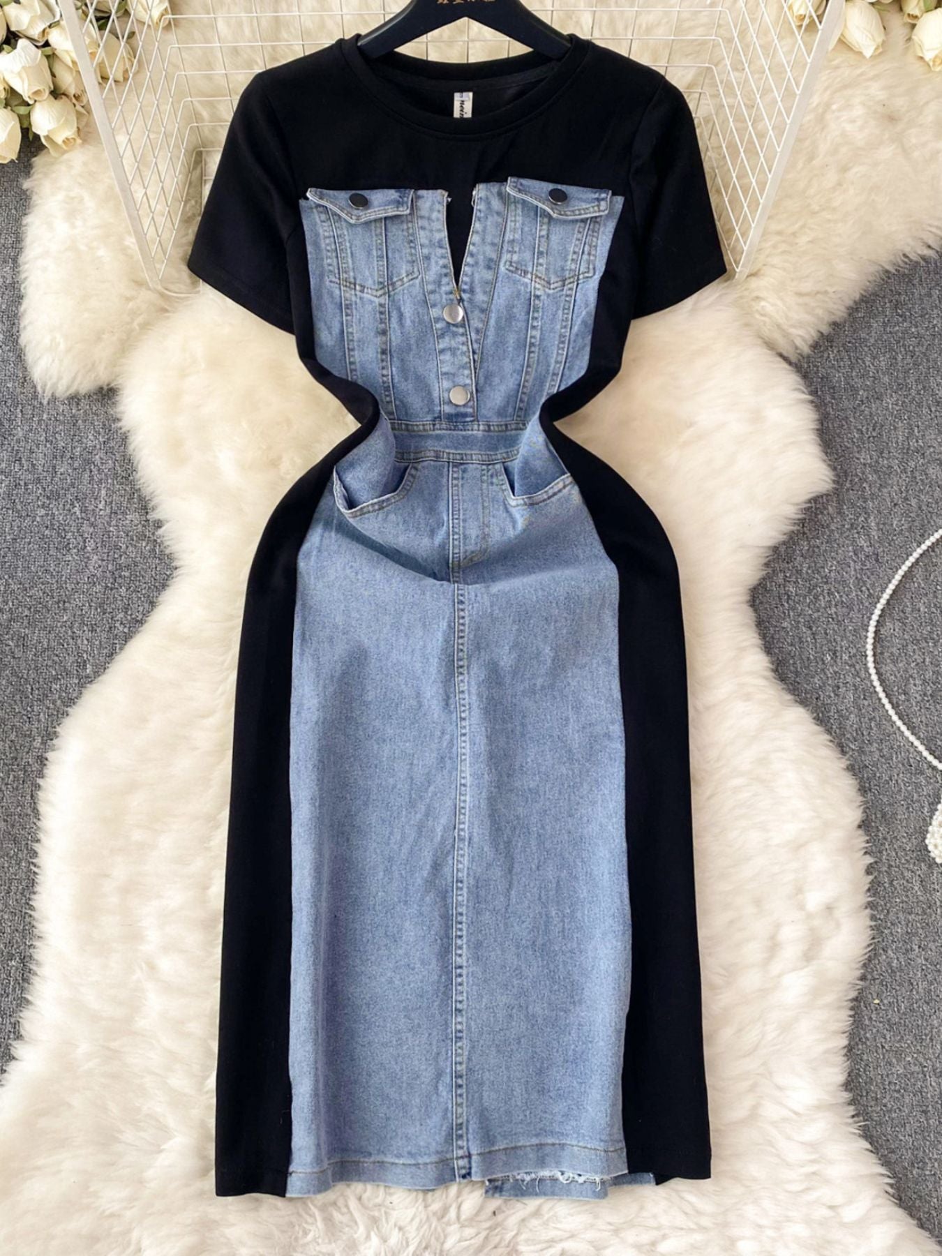 Denim patchwork short-sleeve dress with button-down front and black contrast panels.