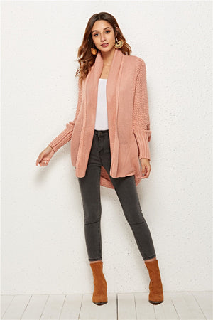 Blush pink acrylic textured cocoon knit cardigan with batwing sleeves and waterfall collar.
