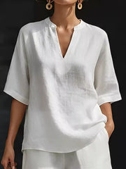 White oversized linen-blend top with V-neck and short sleeves, part of a two-piece set.
