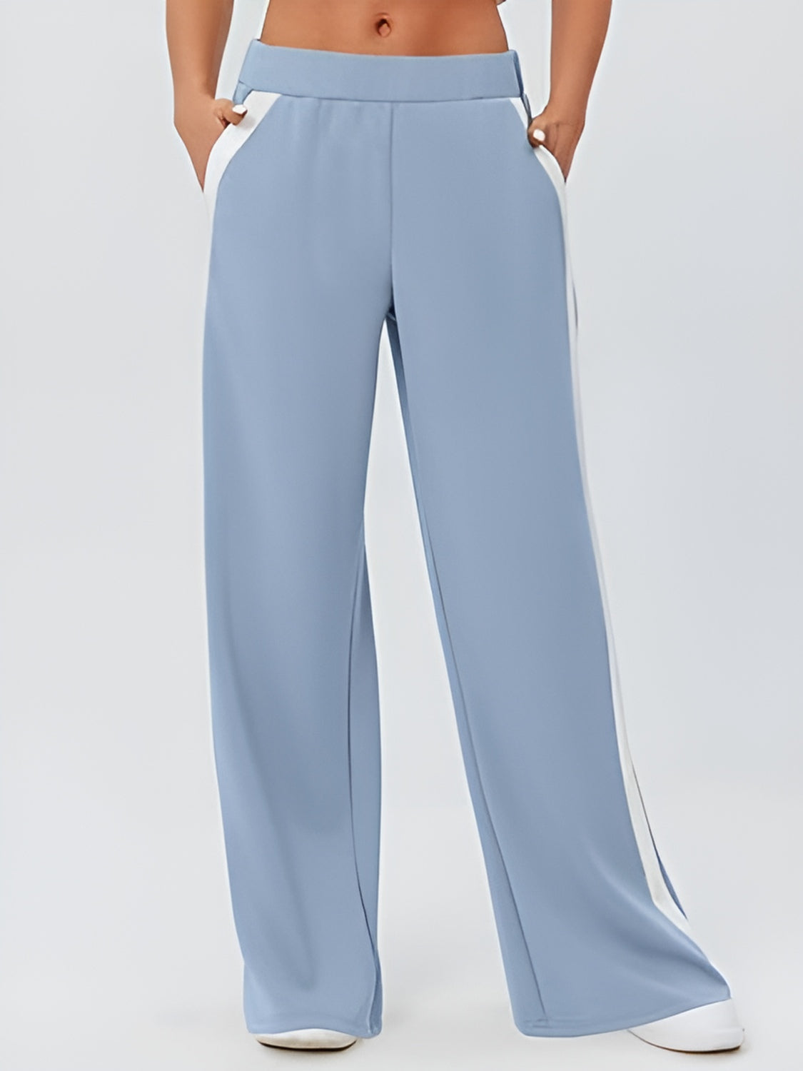 Pastel blue palazzo trousers with contrast white side panels and pockets.