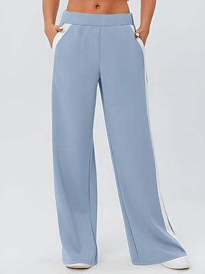 Pastel blue palazzo trousers with contrast white side panels and pockets.