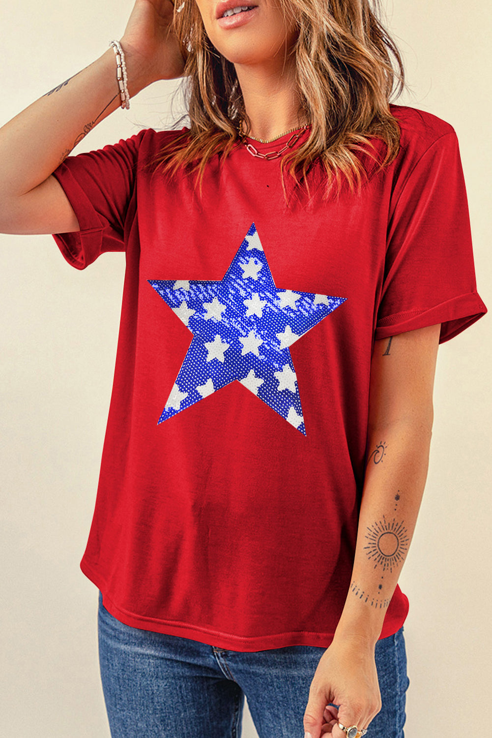 Red cotton blend t-shirt with a distressed blue and white star graphic.