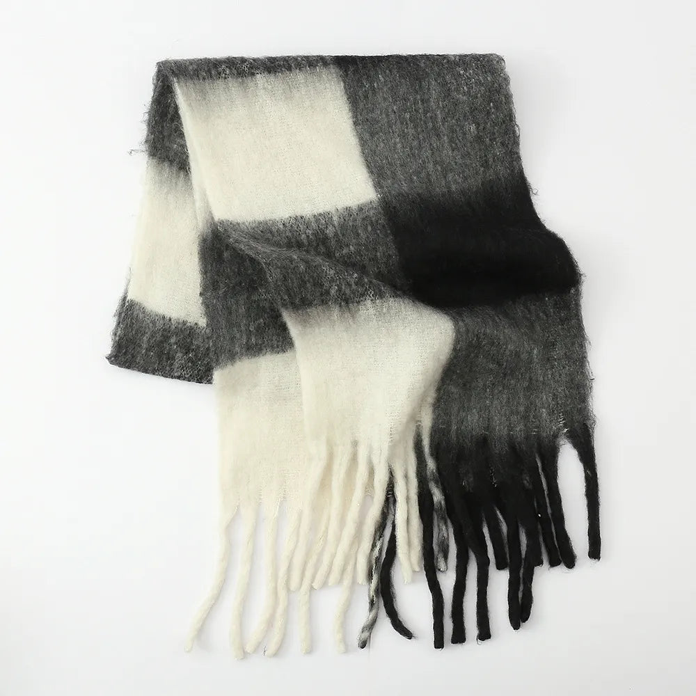 Checked plaid fluffy scarf with fringe detail in black and white.