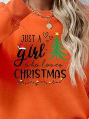 Orange Christmas graphic sweatshirt with text and holiday lights.
