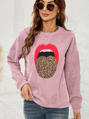 Dusty Pink corduroy crewneck sweatshirt with a red lip and leopard tongue graphic.