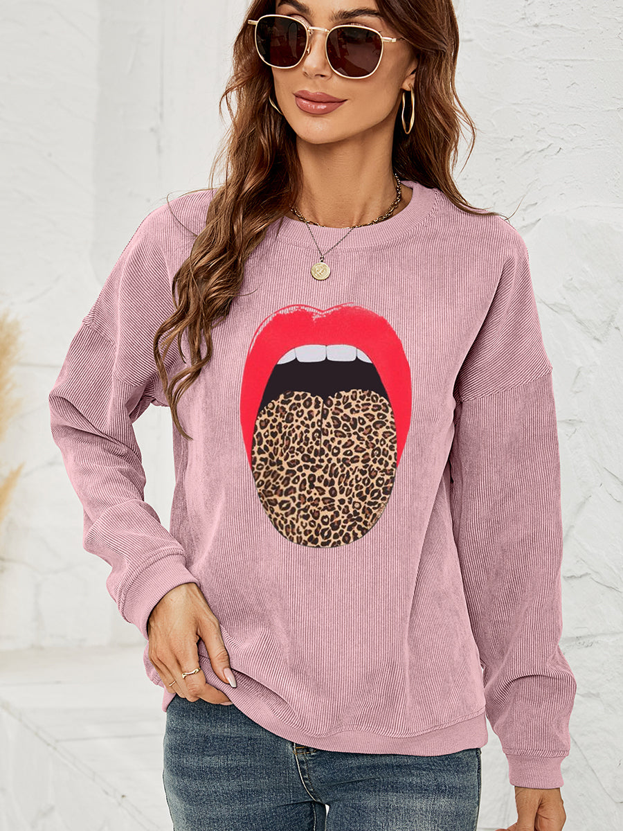 Dusty Pink corduroy crewneck sweatshirt with a red lip and leopard tongue graphic.
