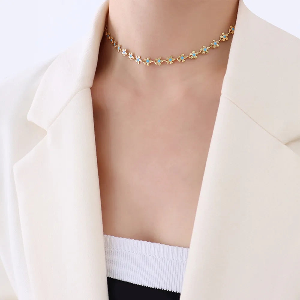 Gold daisy chain enamel petal necklace with blue accents