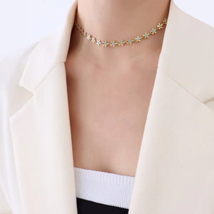 Gold daisy chain enamel petal necklace with blue accents