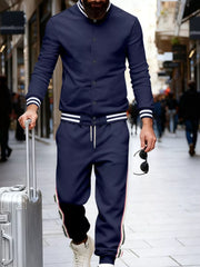 Navy striped two-piece men's activewear set with drawstring track pants and bomber jacket.