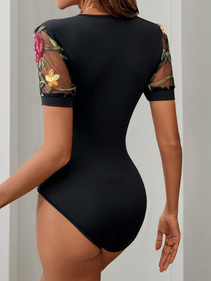 Black bodysuit with embroidered floral mesh sleeves