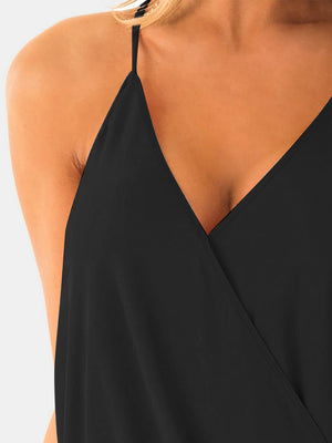 Black draped crossover halter cami with V-neckline and spaghetti straps.