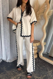 Beige linen shirt and pant set with black scalloped trim