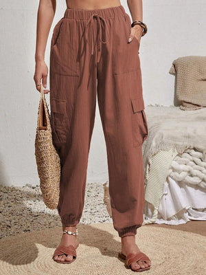 Textured cargo lounge trousers in brown with drawstring waist and cuffed ankles.