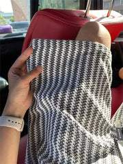 Textured waffle-knit chino shorts in black with a subtle pattern detail.