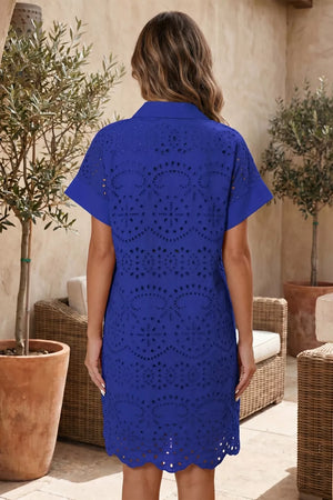 Blue cotton mini dress with allover eyelet embroidery and scalloped hem.