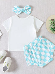 Baby girl outfit: white t-shirt and blue checkered shorts with matching bow headband.