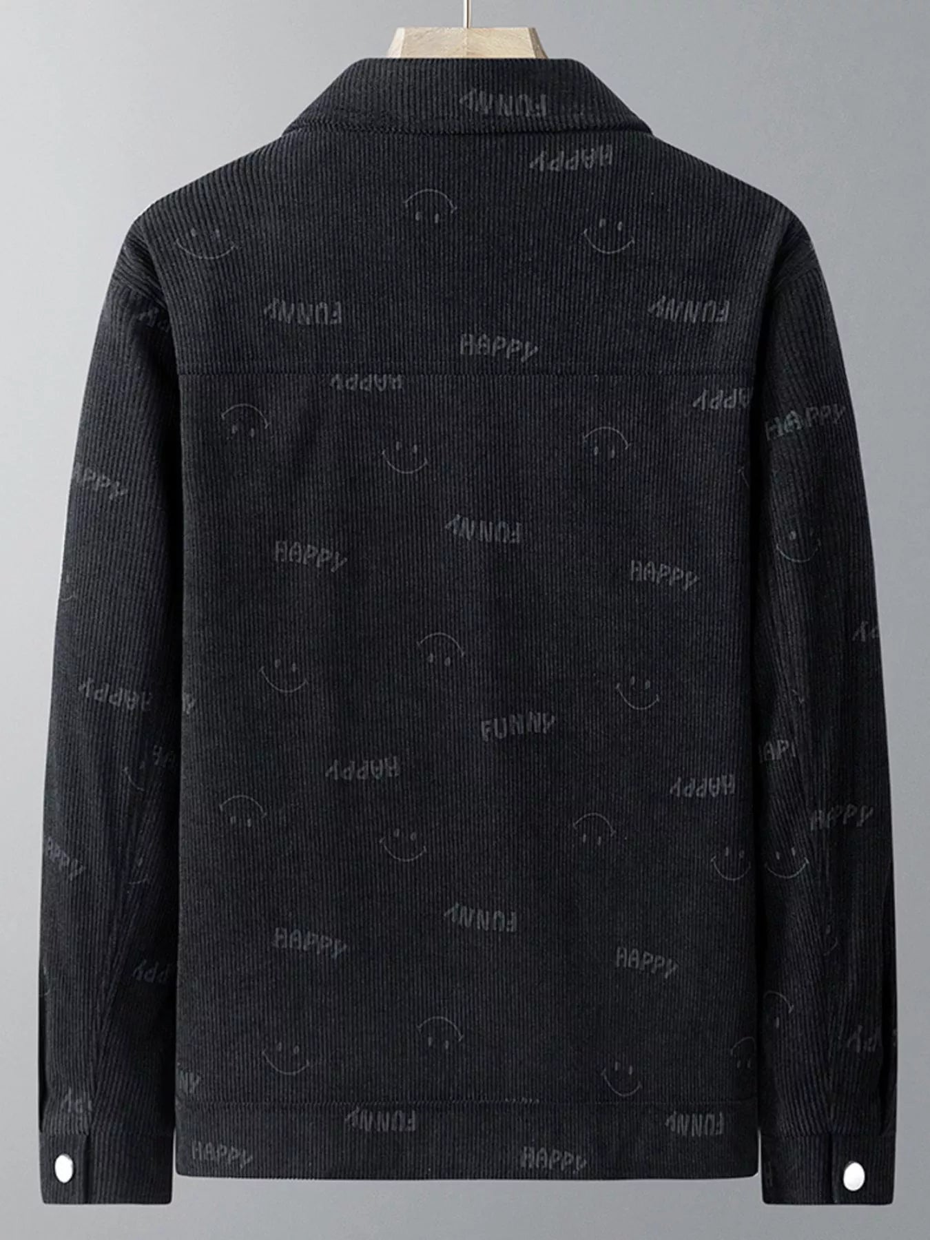 Black corduroy jacket with all-over smiley face and happy text pattern